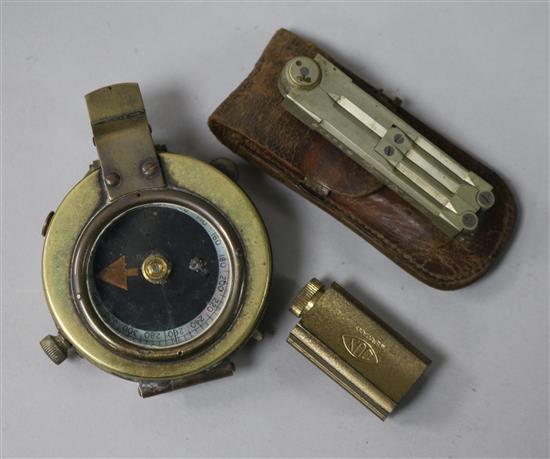 A military compass, a pair of dividers and a pencil sharpener (all leather-cased)